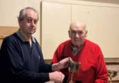 Keith Davies, of Beeches Bayston Hill, is presented with the Singles trophy by secretary Paul Thomas