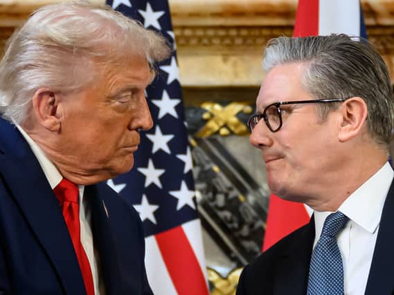 Donald Trump and Sir Keir Starmer look at each other during a press conference at Chequers
