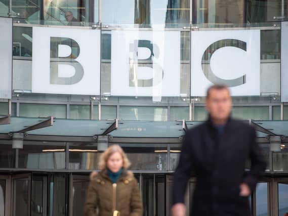 People in front of BBC Broadcasting House