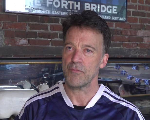 Headshot of Jason Waddleton in a Scotland top