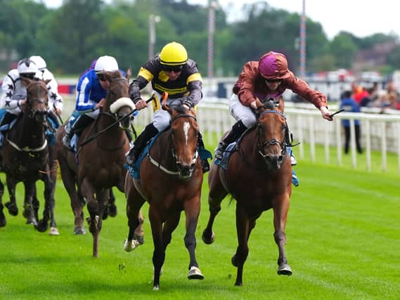 Big Negotiator (yellow cap) booked her ticket to Royal Ascot