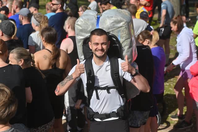 Lee Firmstone - aka The Bale Man - running Telford Parkrun with a hay bale strapped to his back