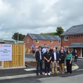 Left to right at the entrance to the Cae’r Hen Ysgol development are: Geraint Roberts, Barcud’s Head of Development; Craig Edwards Quantity Surveyor with JJP Services; Mike Prior JJP Services’ Director; Jamie Davies, JJP Operations Manager; Jason Jones, Barcud Group Chief Executive; Dave Hilliard, JJP Services Contracts Manager; Mark Owen, JJP Services Architect and Kate Curran, Barcud Group Director of Finance, Governance and Investment.

