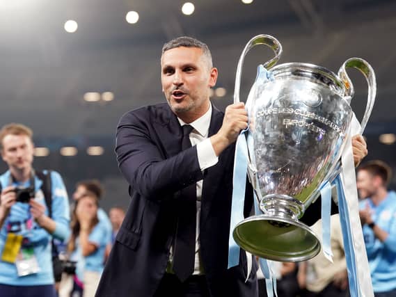 Manchester City chairman Khaldoon Al Mubarak holds the Champions League trophy