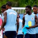 England’s Ezri Konsa (right) and Bukayo Saka (centre) during a training session