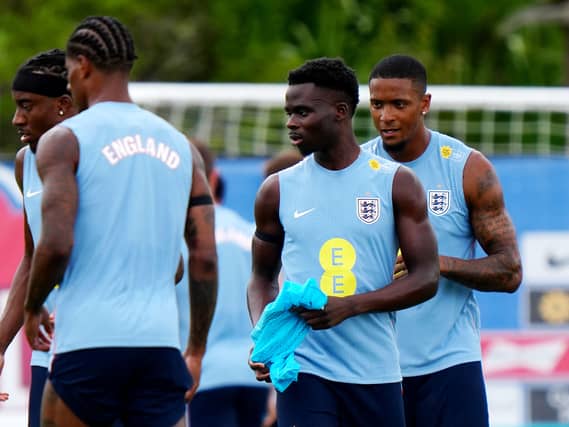 England’s Ezri Konsa (right) and Bukayo Saka (centre) during a training session
