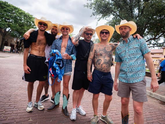 England fans pose for a photo in the Fort Worth Stockyards