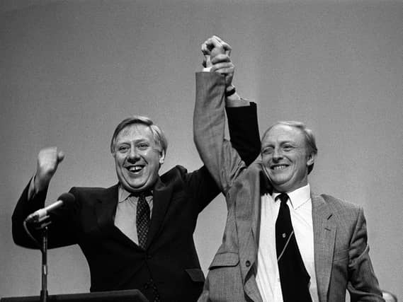 Roy Hattersley (left) with Neil Kinnock celebrating on stage