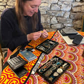 Maryanne Lineker-Mobberley examines jewellery at the valuation event.