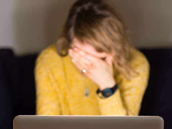 A woman looking stressed