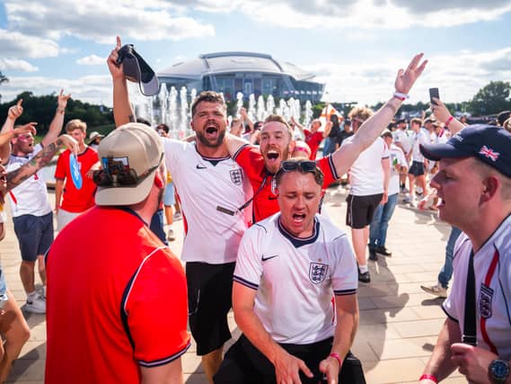 England fans celebrate victory at Texas Live! near the AT&T Stadium in Arlington, Texas