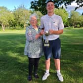 Shrewsbury Golf Club president Jayne Breeze with Shropshire & Herefordshire boys champion Harry Slater