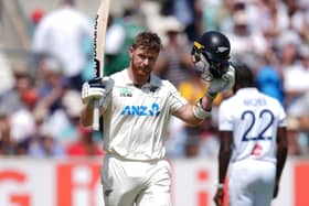 Glenn Phillips celebrates his century