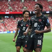 Canada’s Jonathan David (right) celebrates after scoring his side's second goal (Emma Peterson/AP)
