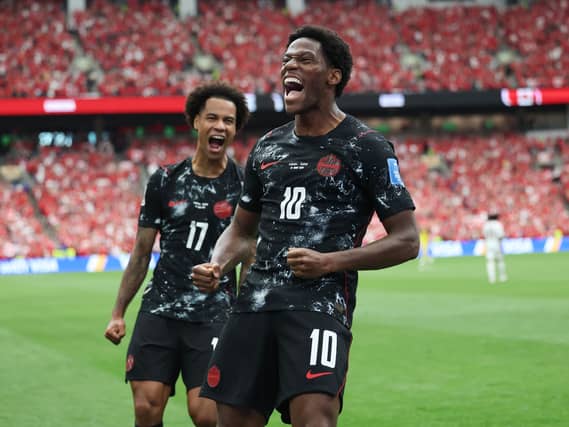 Canada’s Jonathan David (right) celebrates after scoring his side's second goal (Emma Peterson/AP)