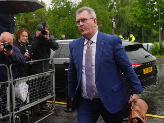 Sir Jeffrey Donaldson walking outside court