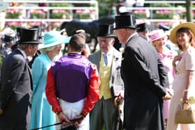King Charles III (centre right) and Queen Camilla (second left) speak with jockey William Buick and trainer John Gosden before the Duke of Edinburgh Stakes