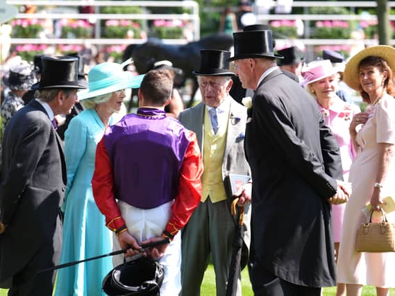 King Charles III (centre right) and Queen Camilla (second left) speak with jockey William Buick and trainer John Gosden before the Duke of Edinburgh Stakes