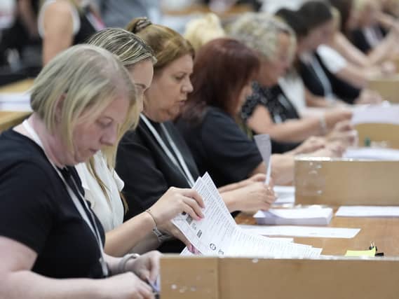 People counting the ballots