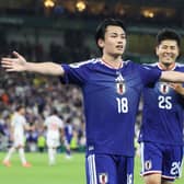 Ayase Ueda (left) celebrates after scoring Japan's fourth goal against Tunisia