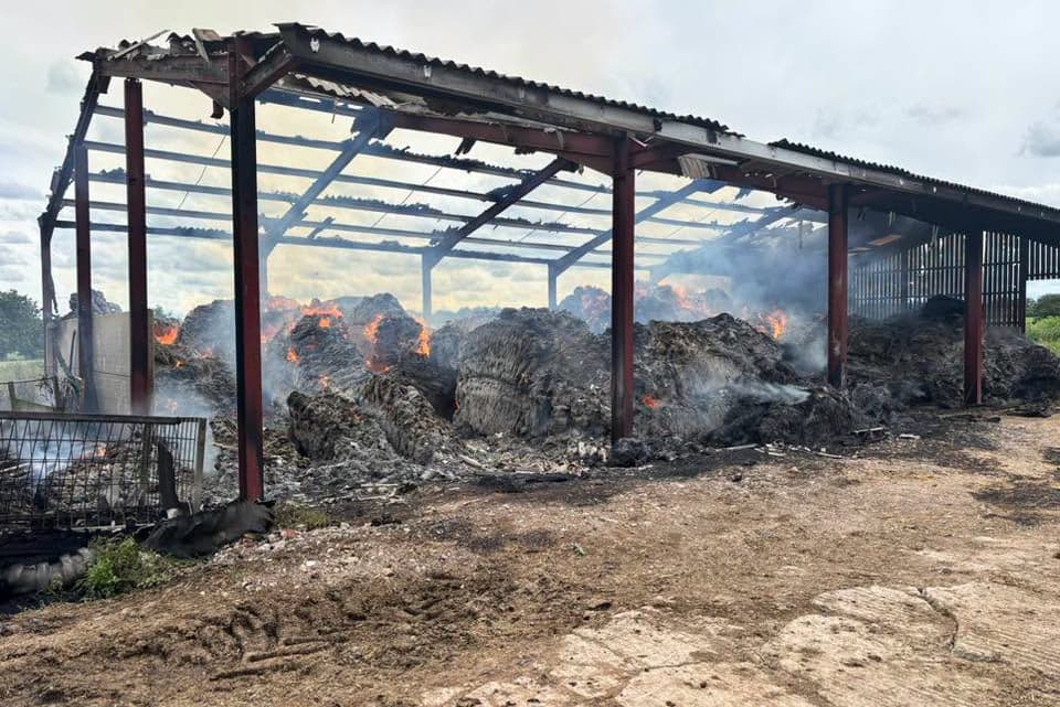 See the smouldering aftermath after 250 tonnes of burning hay sets barn ...