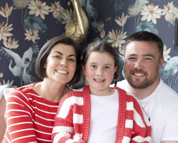 Iona Fagerson, seven, pictured at home with rugby star dad Zander Fagerson and mum Yasmine