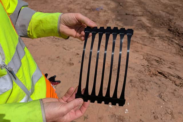 The rebuild will involve constructing the new structure in layers, incorporating a synthetic material - known as a geogrid reinforcement - to spread the weight of the soil