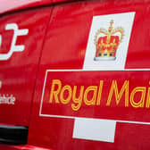 A Royal Mail logo on a van