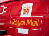 A Royal Mail logo on a van
