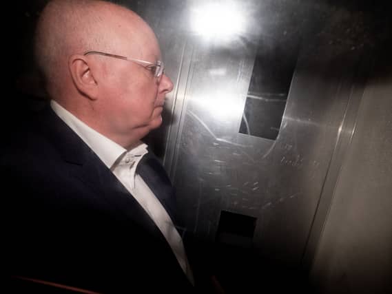 Peter Murrell leaving court in a prison van