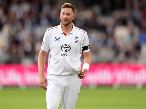 England’s Ollie Robinson walks back to his bowling mark on day one of the first Test at Lord’s