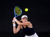 Katie Swan hits a backhand