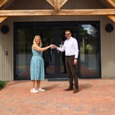 SJ Roberts Construction managing director Mike Sambrook hands over the new activity centre to Condover College chief executive Vikki Pryce