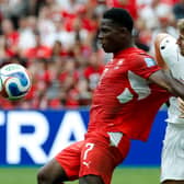 Switzerland’s Breel Embolo (left) fights for the ball with Canada’s Luc de Fougerolles during the World Cup Group B clash in Vancouver