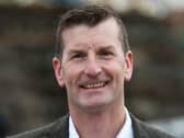 Headshot of Dave Doogan smiling