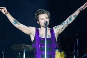 Harry Styles performing on stage
