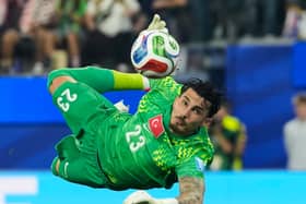 Turkey goalkeeper Ugurcan Cakir makes a save against the USA