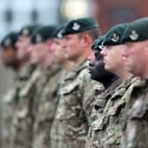 A view of Army personnel in uniform, standing in a line
