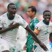 Senegal’s Pape Gueye (26) celebrates their third goal during the World Cup Group I soccer match between Senegal and Iraq in Toronto