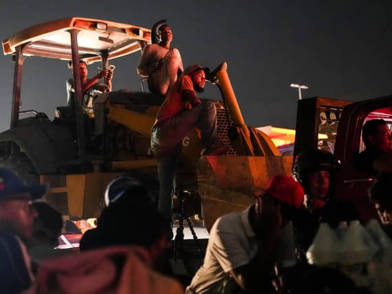 Heavy machinery arrives to help remove debris two days after earthquakes struck La Guaira