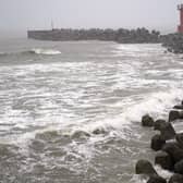 A coastline is hit by high waves as a typhoon approaches Futtsu city