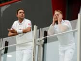 England’s Stuart Broad (left) and Ben Stokes look out from the players balcony