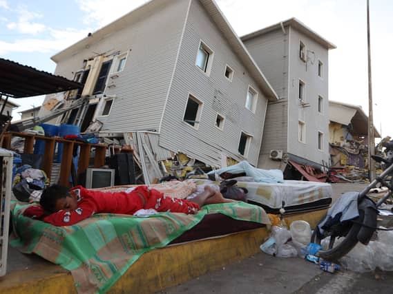 Earthquake-damaged homes in Catia La Mar, Venezuela (Pedro Mattey/AP)