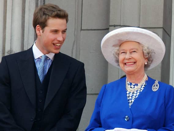 William with his grandmother Queen Elizabeth II on the balcony of Buckingham Palace