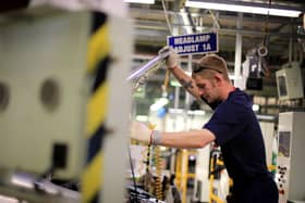 Worker on a Toyota Corolla production line at Toyota?s Derbyshire factory at Burnaston, Derby UK UK.