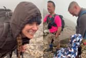 Catherine, the Princess of Wales stops to chat to young fundraiser Ted Haslam from Sutton Coldfield on Scafell Pike as they both took on the Three Peaks Challenge.