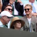 Romeo Beckham wearing sunglasses in the stands at Wimbledon