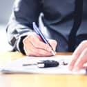 Man signing loan for car