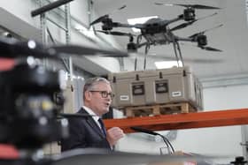 Prime Minister Sir Keir Starmer speaks next to some military drones
