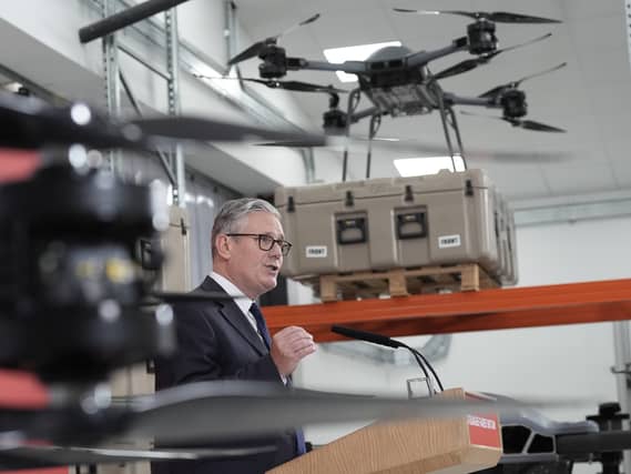 Prime Minister Sir Keir Starmer speaks next to some military drones